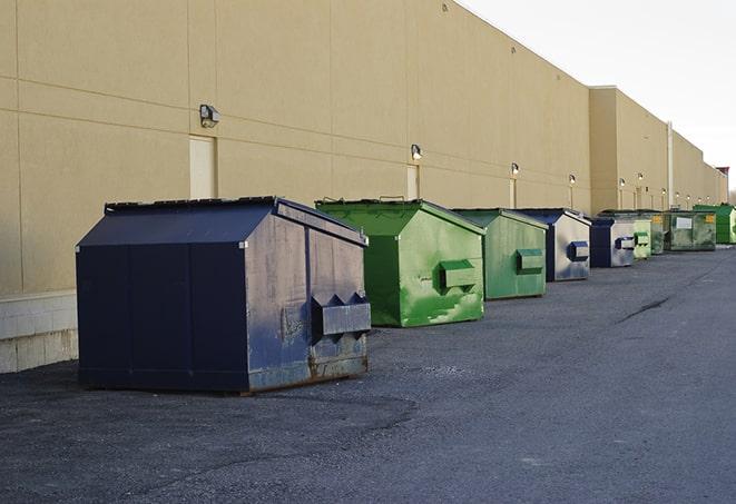 construction waste bins waiting to be picked up by a waste management company in Burley